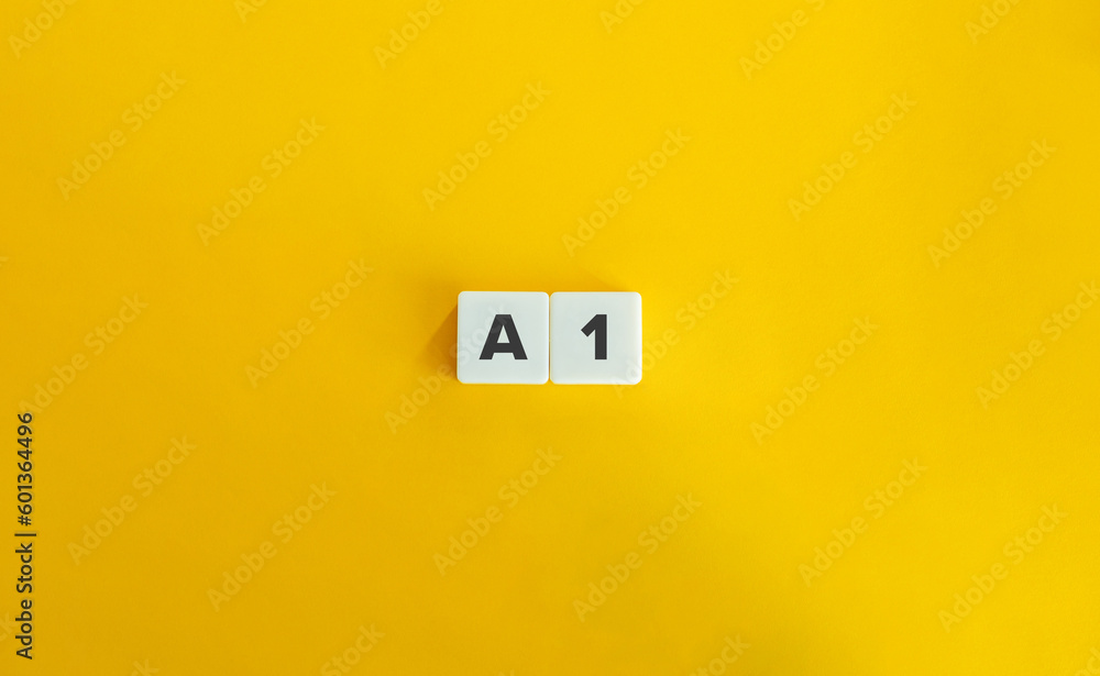 A1 level of language proficiency. Block Letter Tiles on Yellow Background. Minimal Aesthetics. A1 level of language proficiency. Block Letter Tiles on Yellow Background. Minimal Aesthetics.