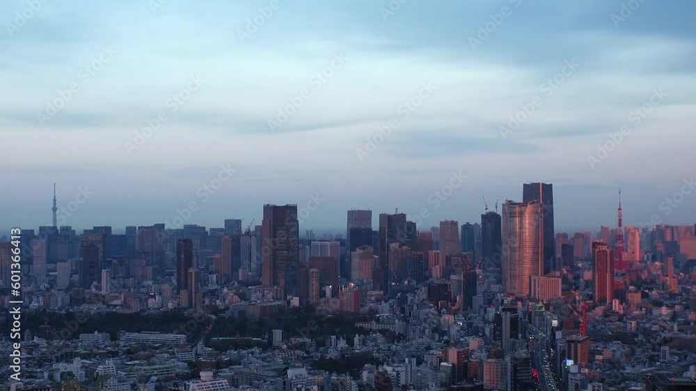 TOKYO, JAPAN : Aerial high angle sunrise CITYSCAPE of TOKYO. View of buildings around Roppongi from Shibuya. Time lapses shot, night to morning. Japanese city life and metropolis concept 4K video. TOKYO, JAPAN : Aerial high angle sunrise CITYSCAPE of TOKYO. View of buildings around Roppongi from Shibuya. Time lapses shot, night to morning. Japanese city life and metropolis concept 4K video.