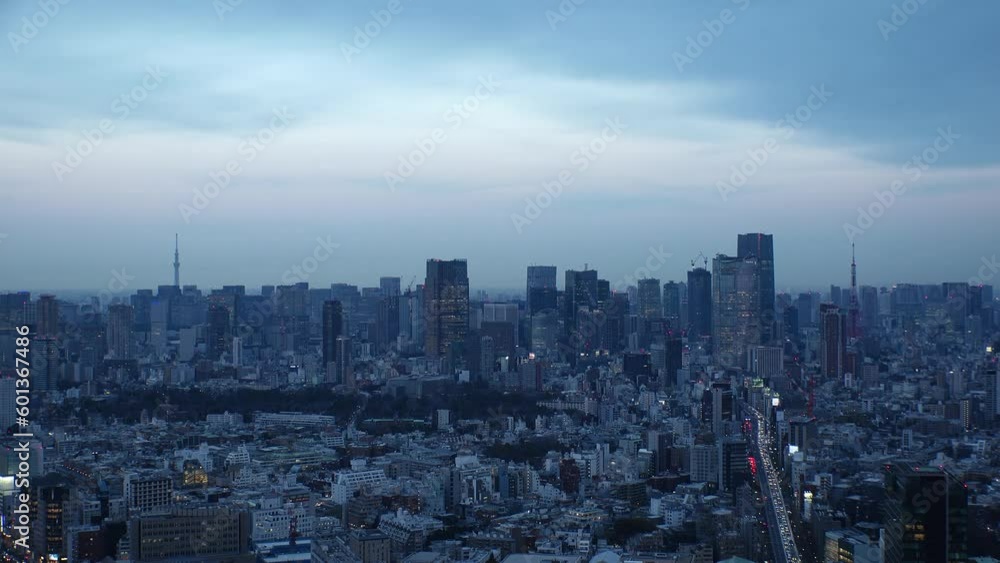TOKYO, JAPAN : Aerial high angle sunset CITYSCAPE of TOKYO. View of buildings around Roppongi from Shibuya. Time lapse shot, dusk to night. Japanese urban city life and metropolis concept video. TOKYO, JAPAN : Aerial high angle sunset CITYSCAPE of TOKYO. View of buildings around Roppongi from Shibuya. Time lapse shot, dusk to night. Japanese urban city life and metropolis concept video.