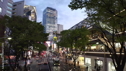 SHIBUYA, TOKYO, JAPAN - APRIL 2023 : View around MIYASHITA PARK. Multi-purpose complex (shopping mall, sports facilities, restaurants, hotel and rooftop park space). Time lapse shot, day to night. photo