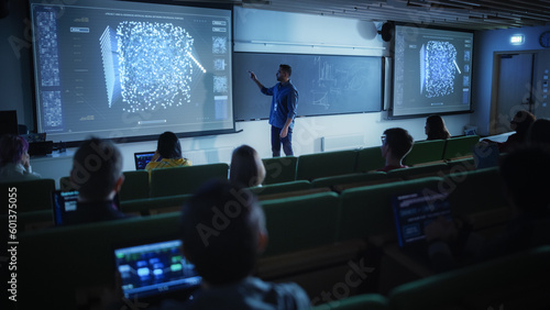 Canvas Print Young Male Teacher Giving a Data Science Lecture to Diverse Multiethnic Group of Female and Male Students in Dark College Room