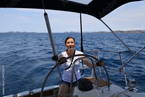 Woman at the helm of Croatia sailboat