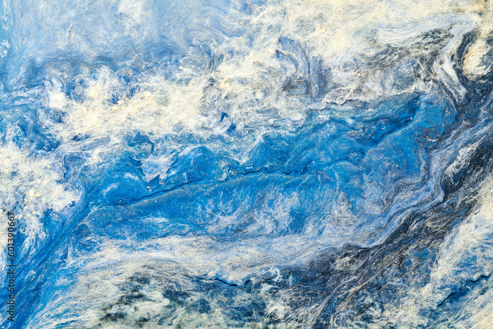 Abstract blue color background. Multicolored fluid art. Waves, splashes and blots acrylic alcohol ink, paints under water