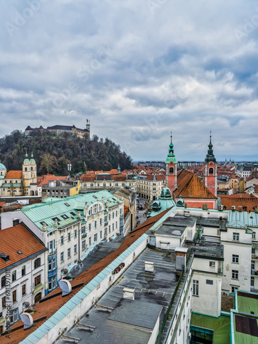 Aerial vertical shot of Ljubljana castle and the old town street during overcast cloud sky, Ljubljana, Slovenia