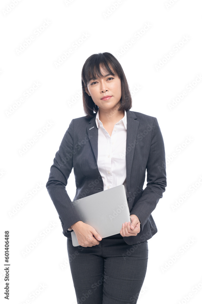 beautiful woman wearing a suit standing and holding a laptop beautiful woman wearing a suit standing and holding a laptop