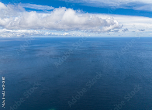 Blue sky with clouds over sea. Open blue ocean. Indonesia.