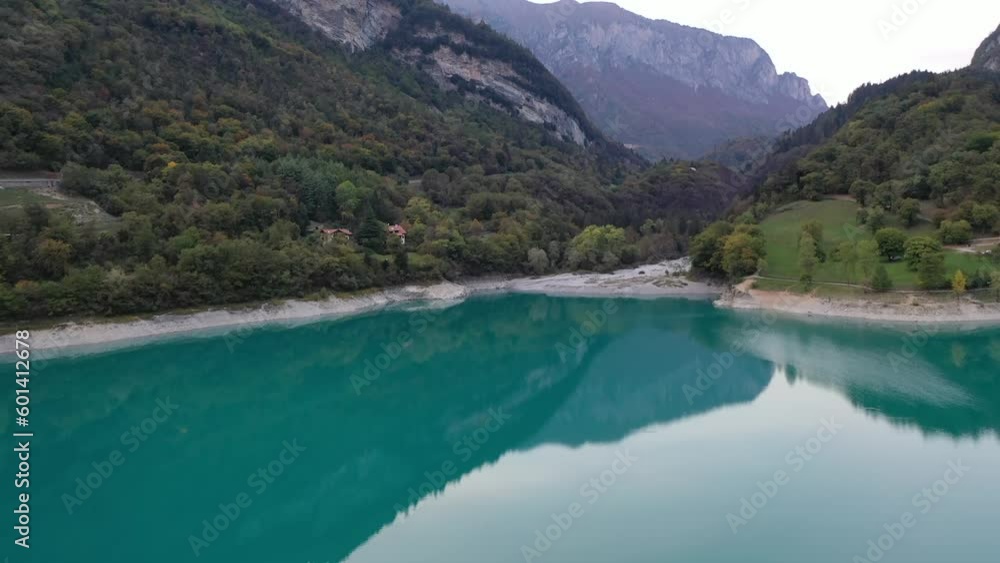 Rounded island on turquoise lake in Italy Rounded island on turquoise lake in Italy