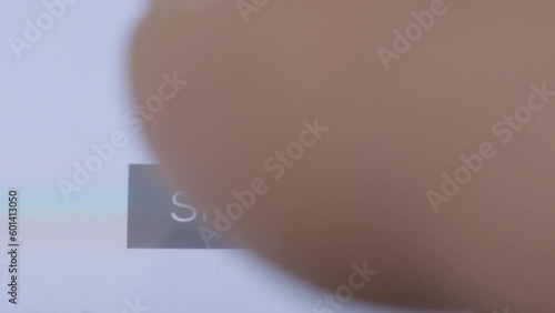 Very Close up shot of a finger skipping ad on Youtube