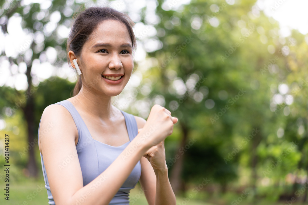 Fitness Asian Girl in tight sportswear doing exercises and punching boxing footwork cardio exercise in park. Female student boxer motivation. Fitness Asian Girl in tight sportswear doing exercises and punching boxing footwork cardio exercise in park. Female student boxer motivation.