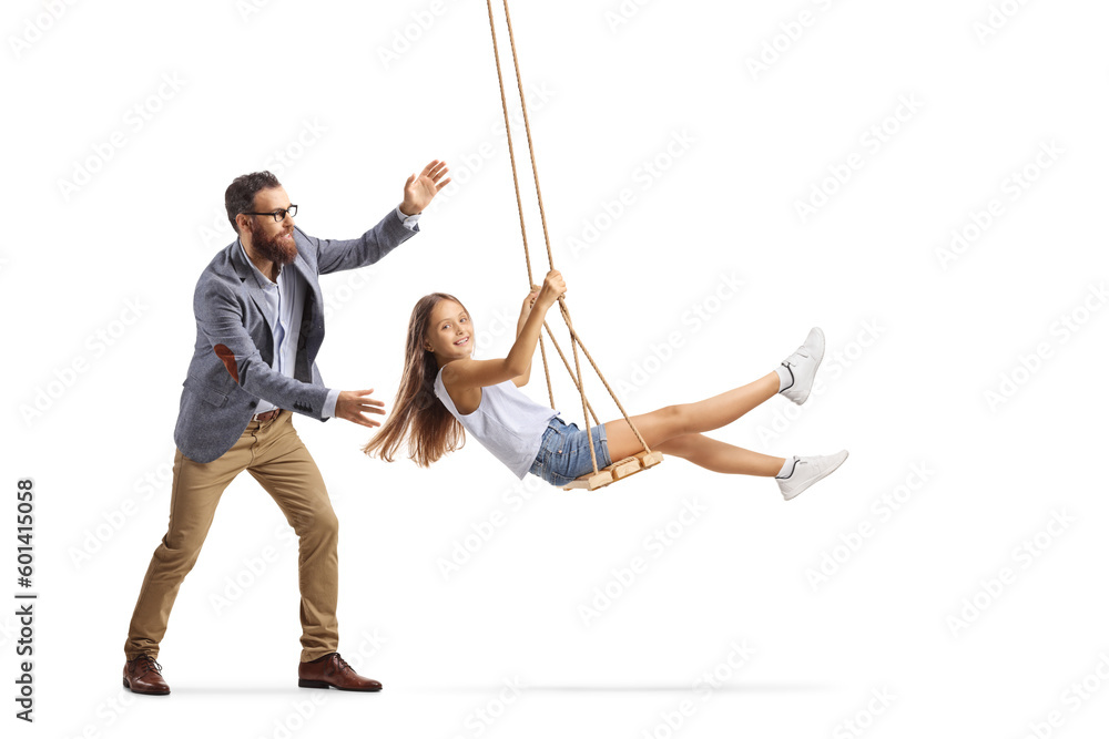 Full length shot of a father pushing a girl on a swing - obrazy, fototapety, plakaty 