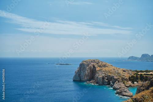 View from Lindos acropolis to St. Paul's bay and mediterranean sea, clear blue sky and emerald sea on the island of Rhodes, a famous place for holidays and travel around the islands