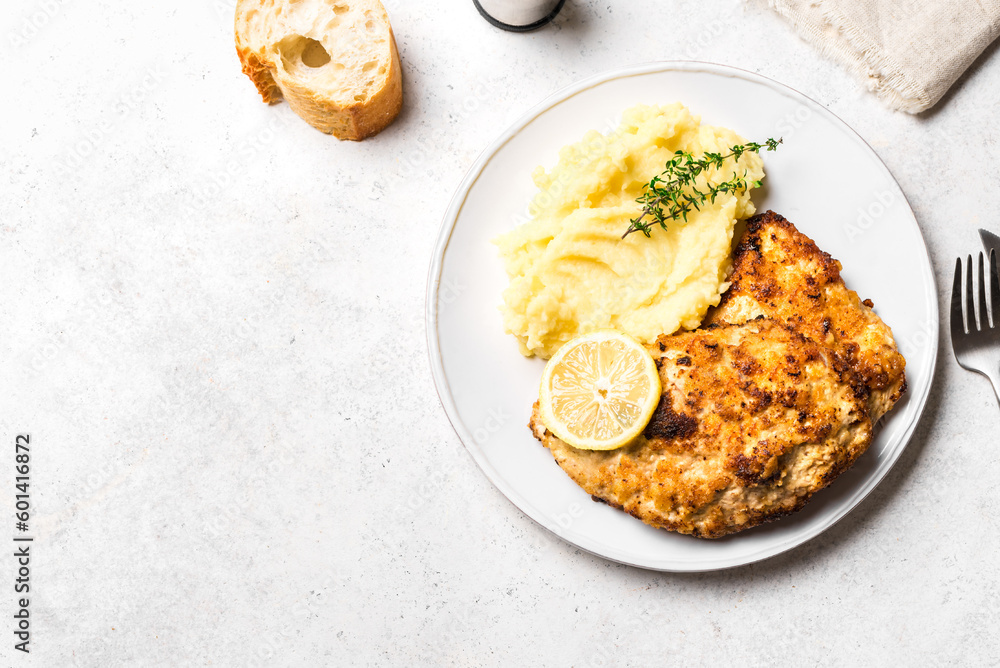 Schnitzel or breaded chop with mashed potatoes Schnitzel or breaded chop with mashed potatoes