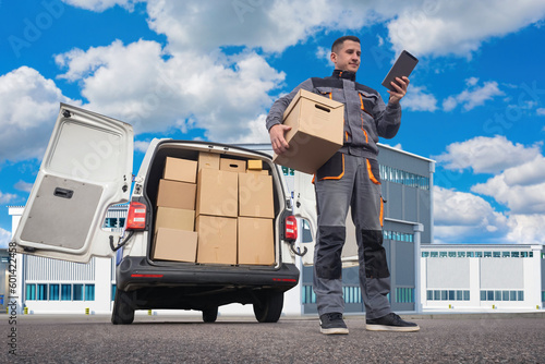 Delivery man with box. Cour...