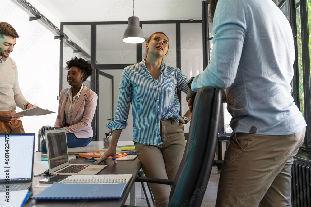 A diverse, casual design team collaborates in the office, creating innovative solutions and fostering in dynamic creative environment. A diverse, casual design team collaborates in the office, creating innovative solutions and fostering in dynamic creative environment.