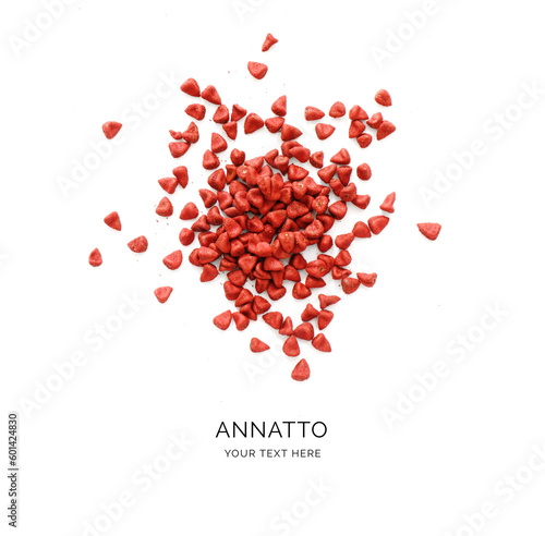 Creative layout made of annatto seeds on white background. Flat lay. Achiote Food Concept. Macro  concept. photo