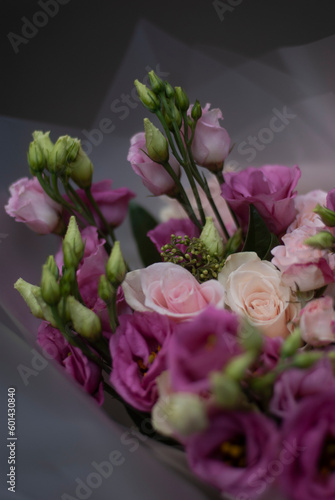 Pink flowers and green plants in a bouquet 