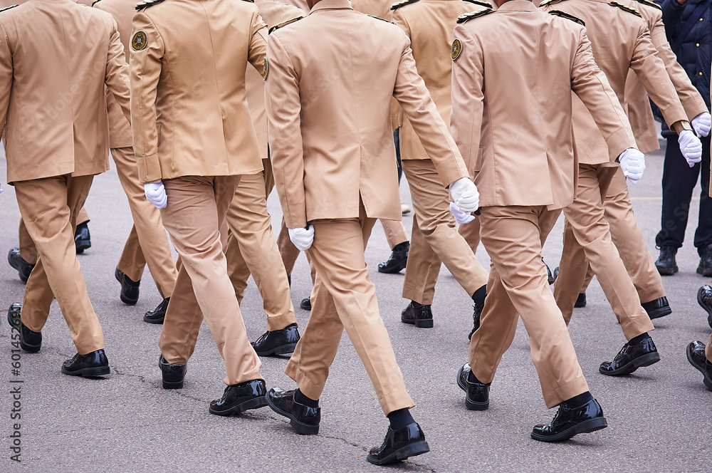 Soldiers marching in the parade on Victory Day. Construction step close up. Soldiers marching in the parade on Victory Day. Construction step close up.