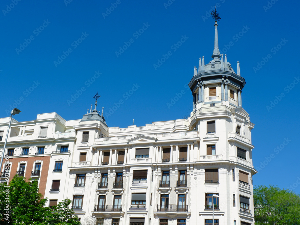 vintage classic building with a spire in the central part of madrid, spain