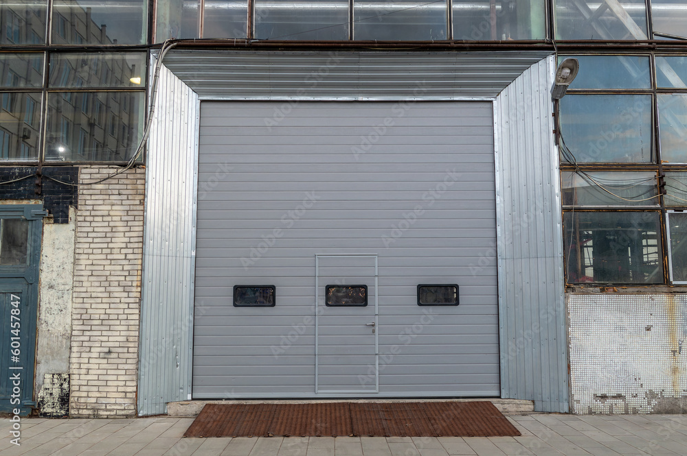 Fototapeta premium Entrance closed by a roller door to the industrial premises