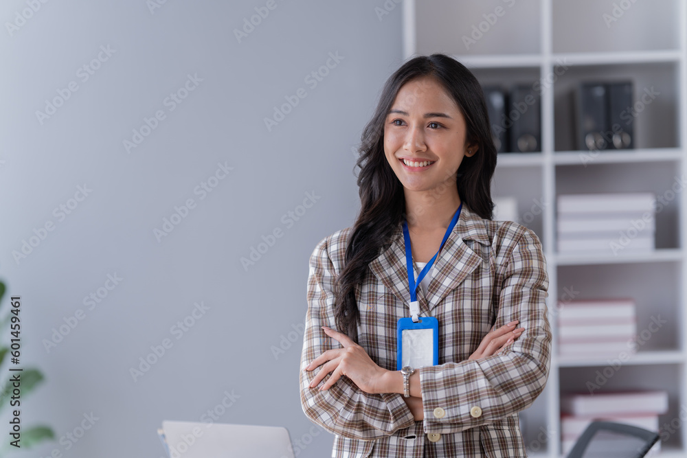 Young happy businesswoman working with tablet and mobile phone in corporate office. Young happy businesswoman working with tablet and mobile phone in corporate office.