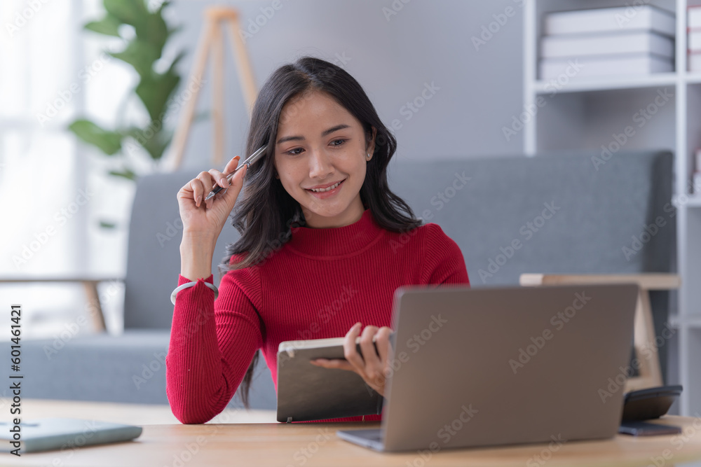 Obraz premium Smile of beautiful woman with earphone and smartphone siting on sofa at home 