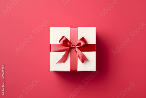 Giftbox with red ribbon on red background - Generative AI © Martin Lang