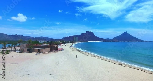 Forward Flight Over Bay from Islands Edge to Glistening Water
