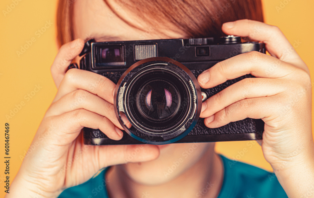 Cheerful smiling child holding a cameras. Little boy on a taking a photo using a vintage camera. Child in studio with professional camera. Boy using a cameras. Baby boy with camera Cheerful smiling child holding a cameras. Little boy on a taking a photo using a vintage camera. Child in studio with professional camera. Boy using a cameras. Baby boy with camera