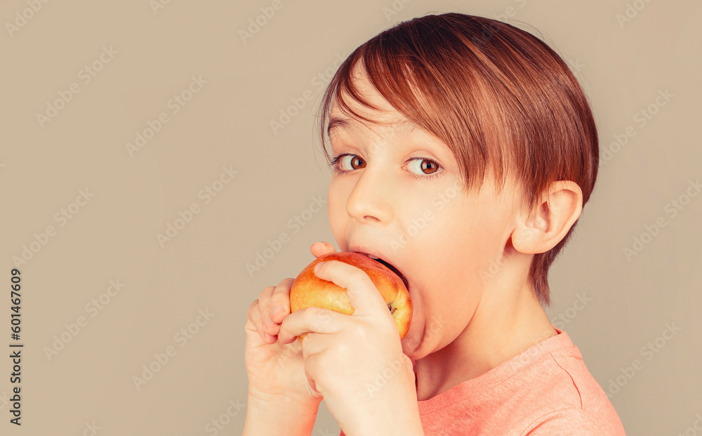 Baby boy eating apple and smiling. Boy smiles and has healthy white teeth. Little boy eating apple. Boy apples showing. Child with apples Baby boy eating apple and smiling. Boy smiles and has healthy white teeth. Little boy eating apple. Boy apples showing. Child with apples