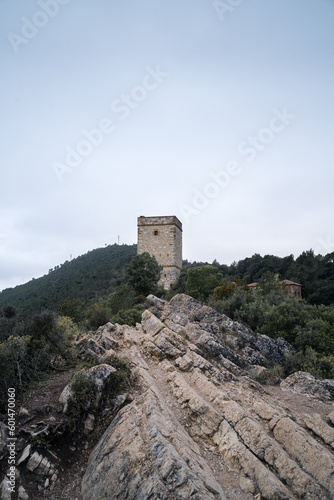 Rocky Path Leading to Telegraph Tower on the Hill with Overcast Sky