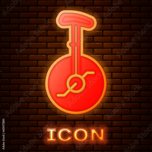 Glowing neon Unicycle or one wheel bicycle icon isolated on brick wall background. Monowheel bicycle. Vector