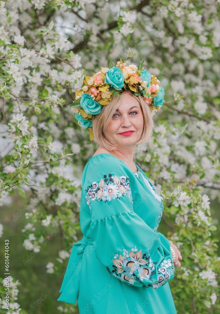 Mature older blonde woman in Ethnic dress. Fashionable details Mature older blonde woman in Ethnic dress. Fashionable details