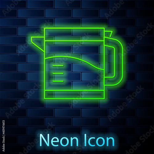 Glowing neon Electric kettle icon isolated on brick wall background. Teapot icon. Vector