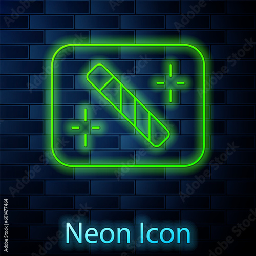 Glowing neon line Photo retouching icon isolated on brick wall background. Photographer, photography, retouch icon. Vector