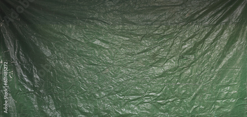 green abstract crumpled old tarpaulin background