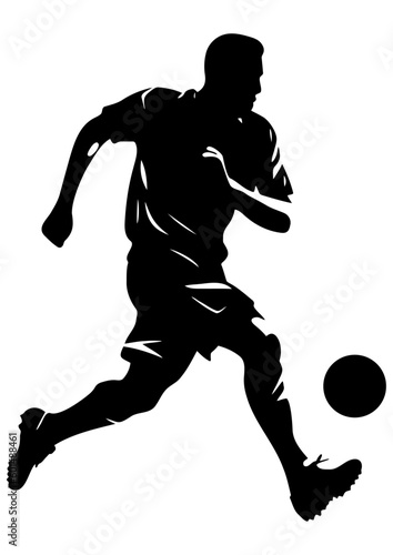 Silhouette of a soccer player shooting the ball