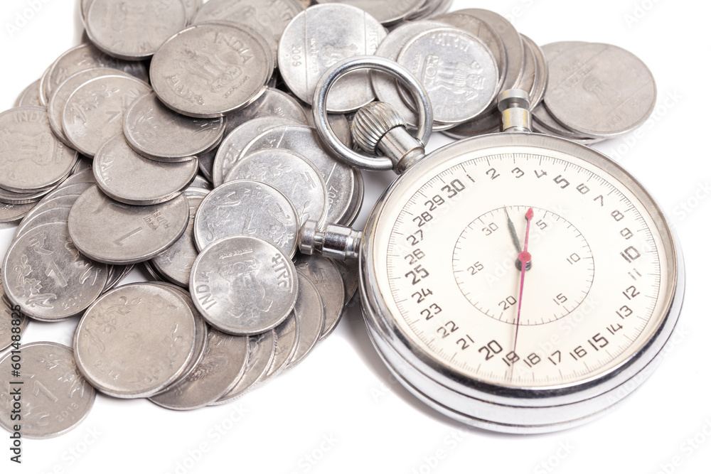 Time is money. Stopwatch and stacks of Indian rupees coins