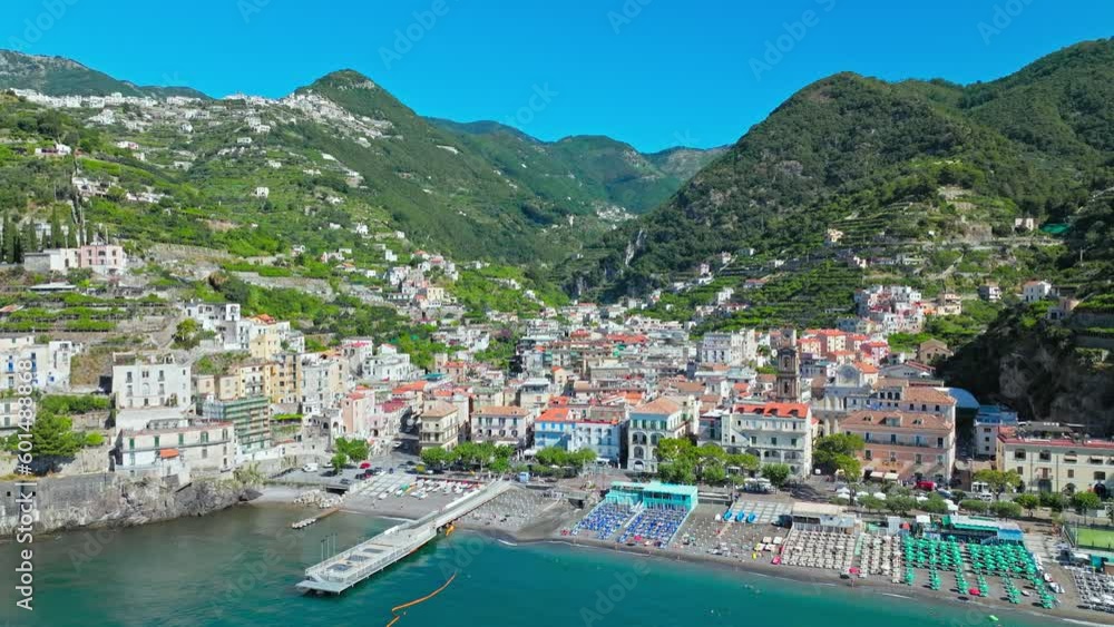 Aerial drone view of Minori Town with a Front Beach and colourful Amalfi houses. Top view of the Basilica of Saint Trofimena and Minori comune in the province of Salerno on a sunny summer day in Italy Aerial drone view of Minori Town with a Front Beach and colourful Amalfi houses. Top view of the Basilica of Saint Trofimena and Minori comune in the province of Salerno on a sunny summer day in Italy