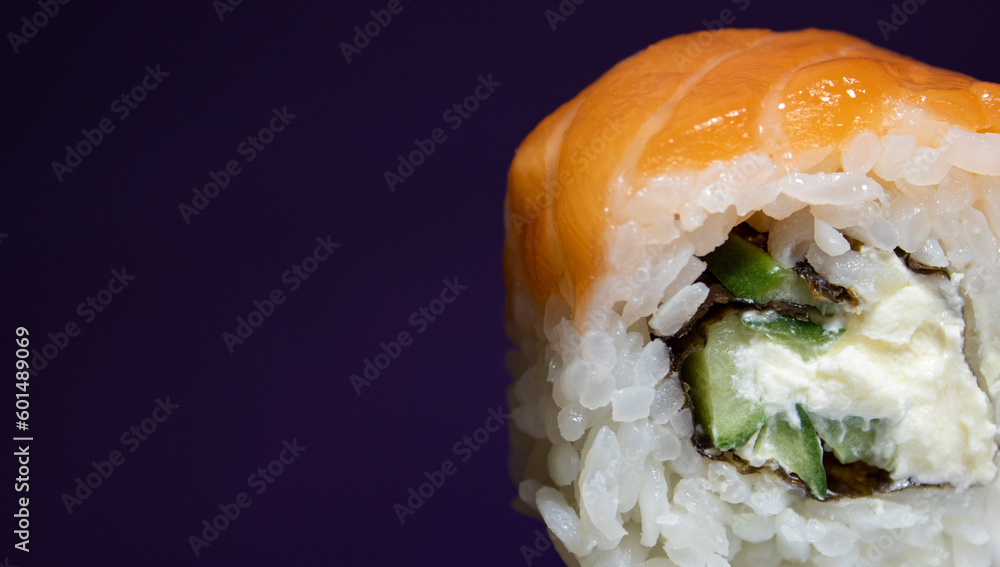 Sushi with Salmon on a Purple Background Closeup. Traditional Japanese Sushi. Closeup Fresh Sushi. Japanese food. Sushi Nigiri Consisting of Rice, Salmon Fillet. Sushi with Salmon on a Purple Background Closeup. Traditional Japanese Sushi. Closeup Fresh Sushi. Japanese food. Sushi Nigiri Consisting of Rice, Salmon Fillet.