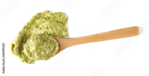Green mojo sauce, mojo verde, spilled in wooden spoon isolated on white, clipping path  photo