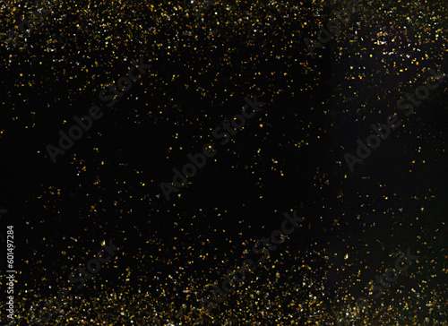 Isolated Amber Gold Glitter Texture on Black Background for Creative Projects and Celebratory Designs
