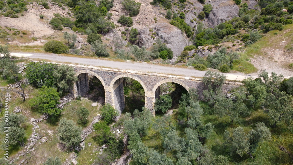 Tatar Bridge - Very old stone arch bridge from Ottoman or even older times about 30 m long with three arches, 2 central piers, completely preserved near Urla, Turkish Aegean Sea