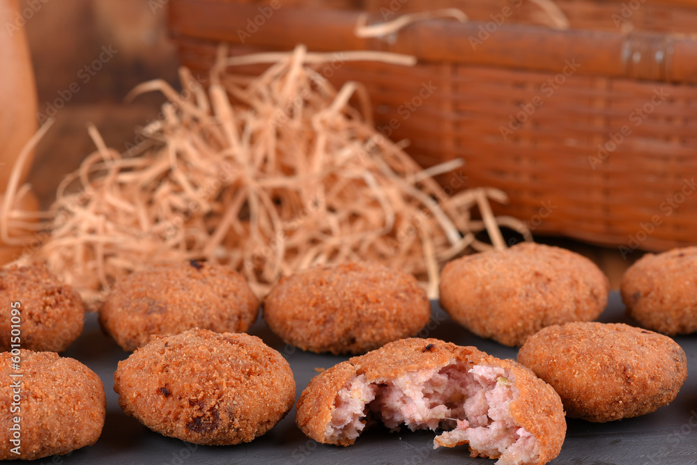 Fototapeta premium Fried and breaded codfish cake, fish empanadas, codfish cake, Brazilian-style codfish cakes, meat disc