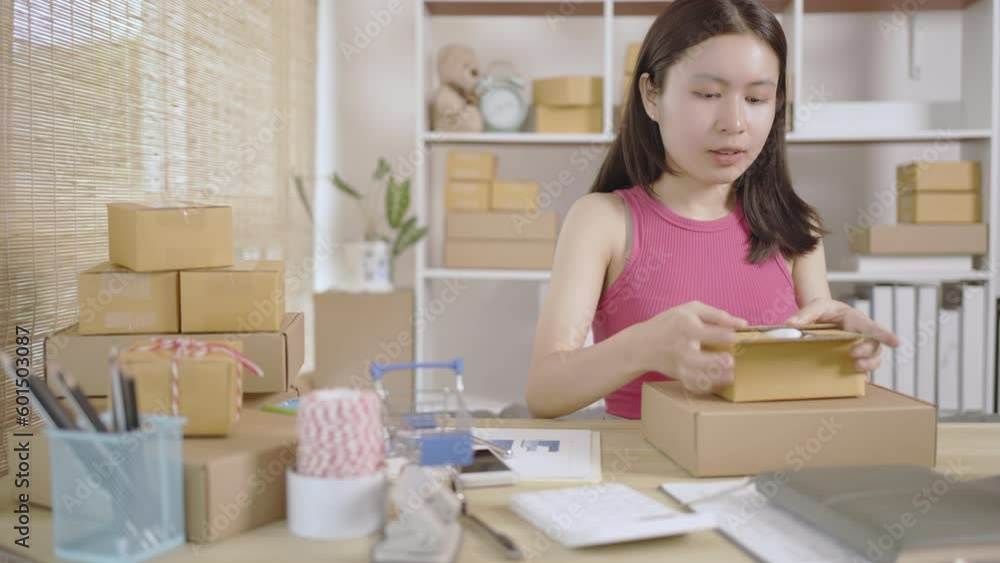 Pack products, Man packing goods into a postal box, Online Shopping, Freelance working, Sell products online. Pack products, Man packing goods into a postal box, Online Shopping, Freelance working, Sell products online.