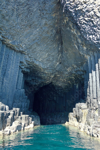 The famous Fingal's Cave at Staffa island, hexagonal basalt columns above green seawater, Inner Hebrides, Scotland. photo