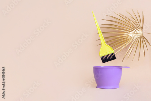 Bright bowl hair coloring brush palm leaf. Background for hair salon designs with copy space. Hairdressing accessories in minimalist style