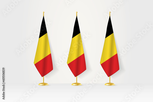 Three Belgium flags in a row on a golden stand, illustration of press conference and other meetings. photo