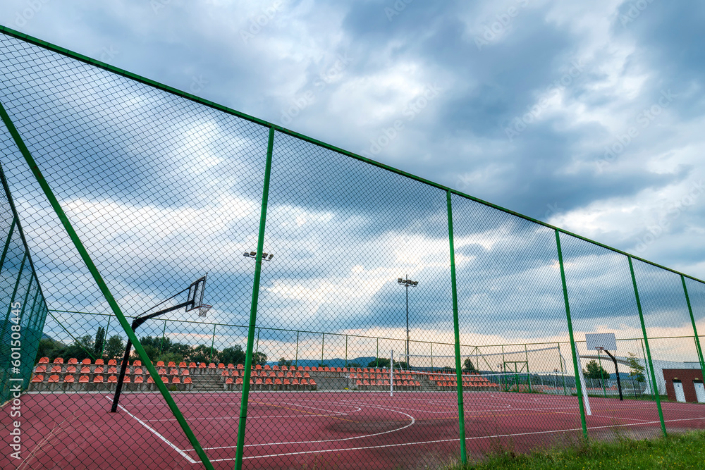 Sports ground in the city, public basketball, and football court Sports ground in the city, public basketball, and football court