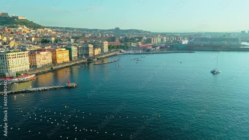 Aerial landmarks view of Castel Nuovo, Royal Palace of Naples, San Carlo Theatre. Scenic golden sunrise over the famous historical tourist attractions and colourful houses of Naples in Italy, Europe Aerial landmarks view of Castel Nuovo, Royal Palace of Naples, San Carlo Theatre. Scenic golden sunrise over the famous historical tourist attractions and colourful houses of Naples in Italy, Europe