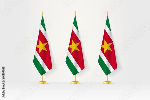 Three Suriname flags in a row on a golden stand, illustration of press conference and other meetings.